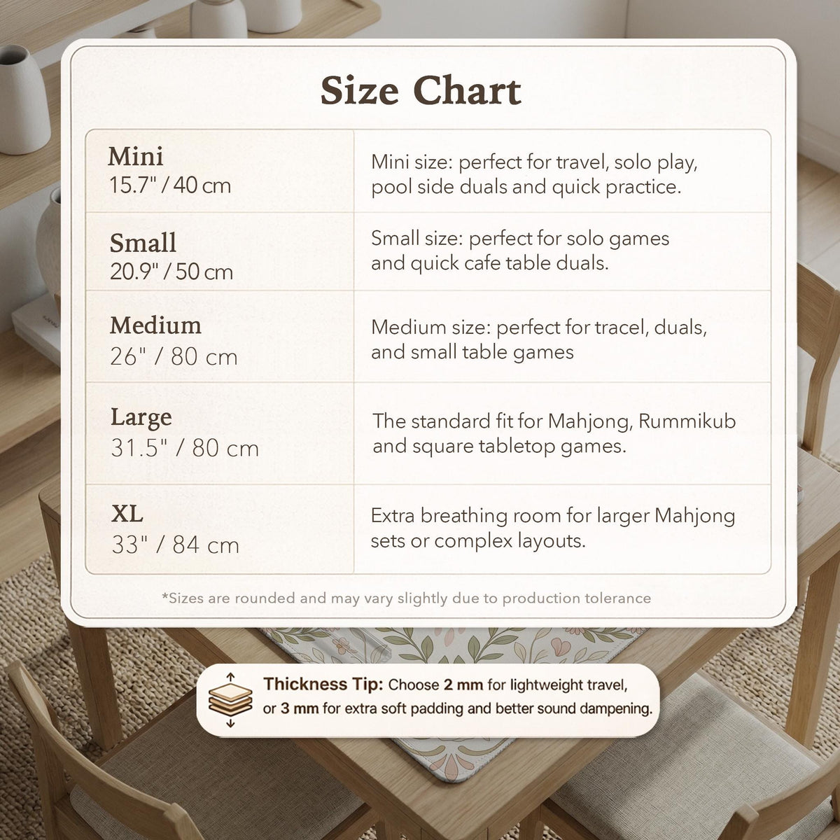 Square mahjong mat with a light floral border in sage green, cream, and blush around a plain center play area.