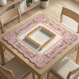 Pink gingham mahjong mat with a floral border, cherry blossom details, and a bow design around a plain center play area.