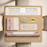 Pink gingham mahjong mat with a floral border, cherry blossom details, and a bow design around a plain center play area.