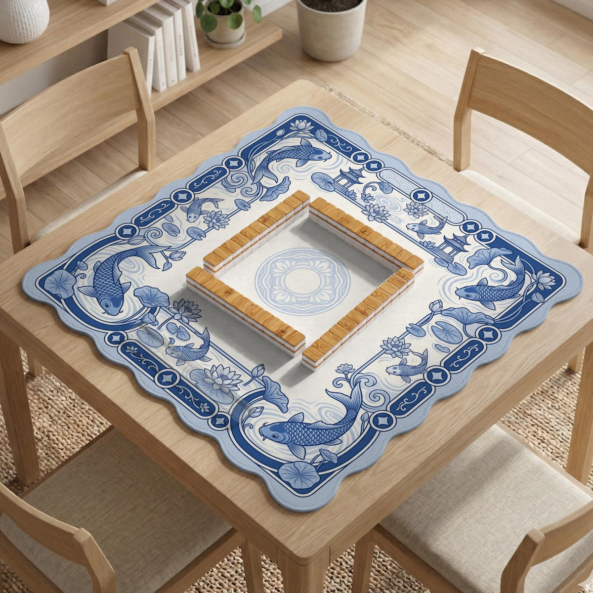 Blue and white square mahjong mat with a koi fish and lotus border design and a plain center area.