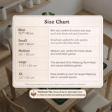Square emerald green mahjong mat with bamboo line art, gold geometric cloud shapes, and a plain center playing area.