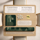 Square emerald green mahjong mat with bamboo line art, gold geometric cloud shapes, and a plain center playing area.