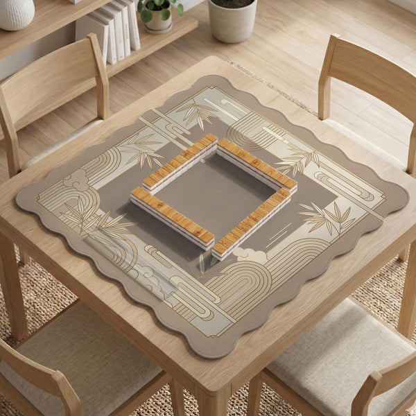 Beige and gold square mahjong mat with a bamboo pattern and geometric border.