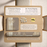 Beige and gold square mahjong mat with a bamboo pattern and geometric border.