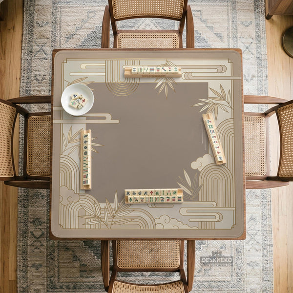Beige and gold square mahjong mat with a bamboo pattern and geometric border.
