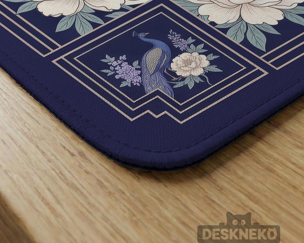 Blue mahjong table mat with a peacock and floral border, ivory center, lavender flowers, and scalloped edges.