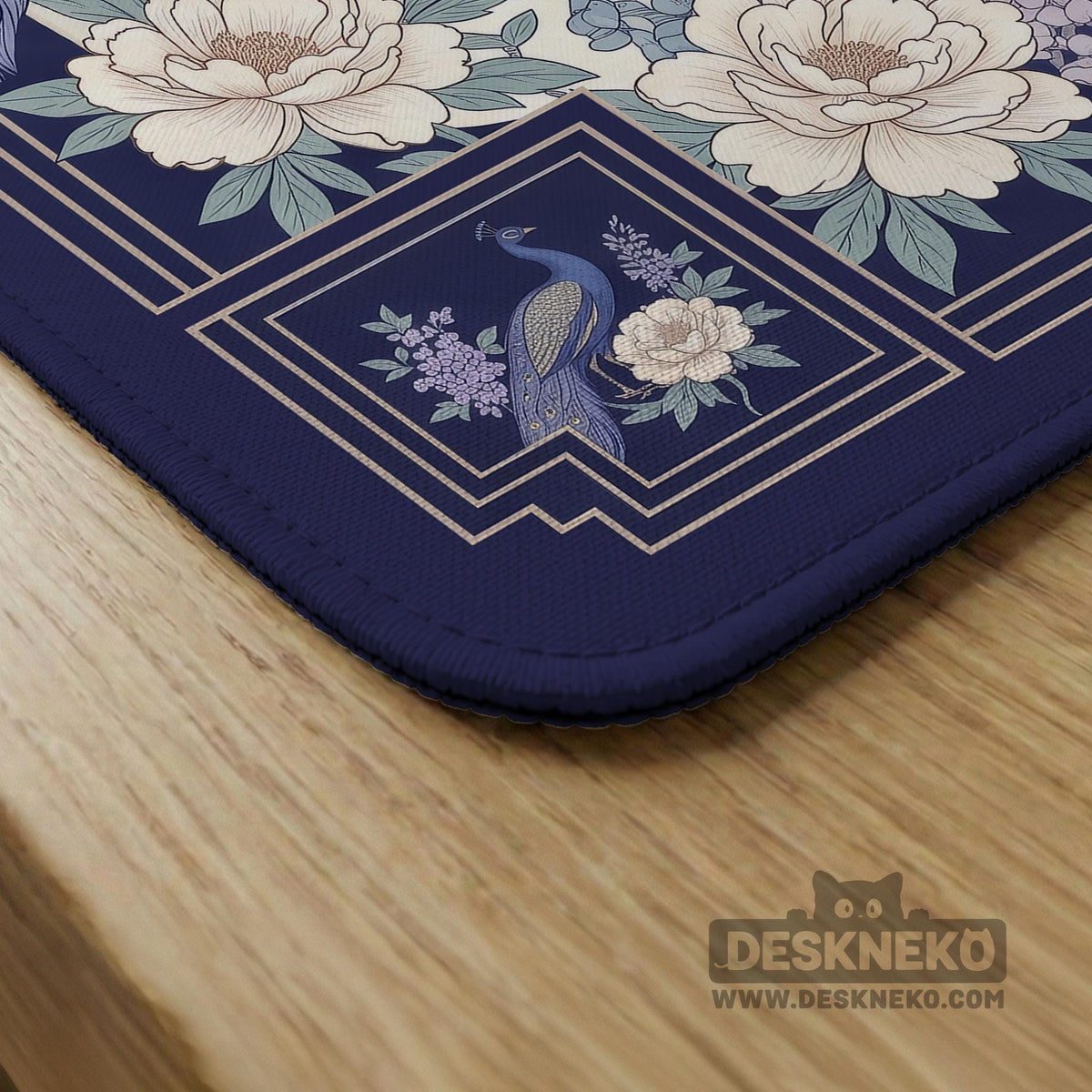 Blue mahjong table mat with a peacock and floral border, ivory center, lavender flowers, and scalloped edges.