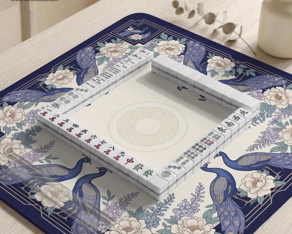 Blue mahjong mat with a floral peacock border and an open center area for tile play.
