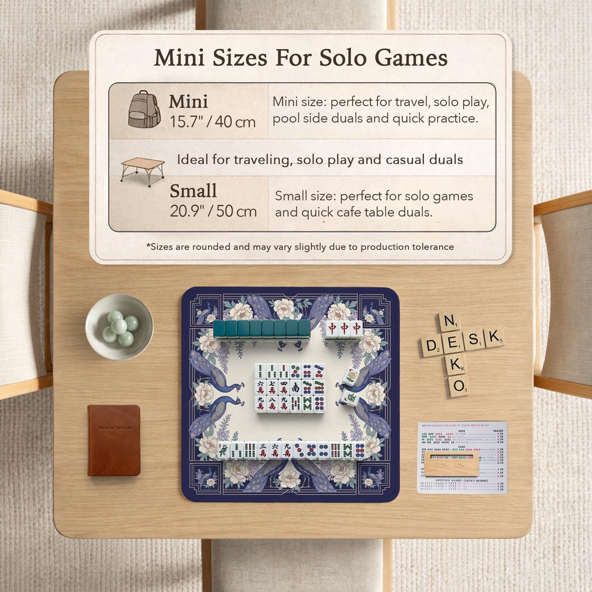 Blue mahjong mat with a floral peacock border and an open center area for tile play.