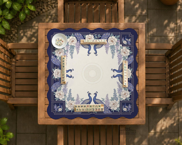 Blue mahjong table mat with a peacock and floral border, ivory center, lavender flowers, and scalloped edges.