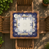 Blue mahjong table mat with a peacock and floral border, ivory center, lavender flowers, and scalloped edges.