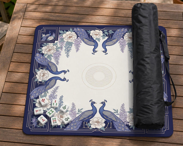Blue mahjong mat with a floral peacock border and an open center area for tile play.