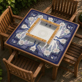 Blue mahjong table mat with a peacock and floral border, ivory center, lavender flowers, and scalloped edges.