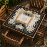 Square ivory mahjong mat with a black peacock border, cream flowers, and gold accent details.