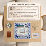Square blue and white mahjong mat with peonies, cranes, pagoda accents, and chinoiserie linework around a plain center.