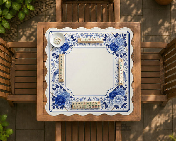 Square blue and white mahjong mat with peonies, cranes, pagoda accents, and chinoiserie linework around a plain center.