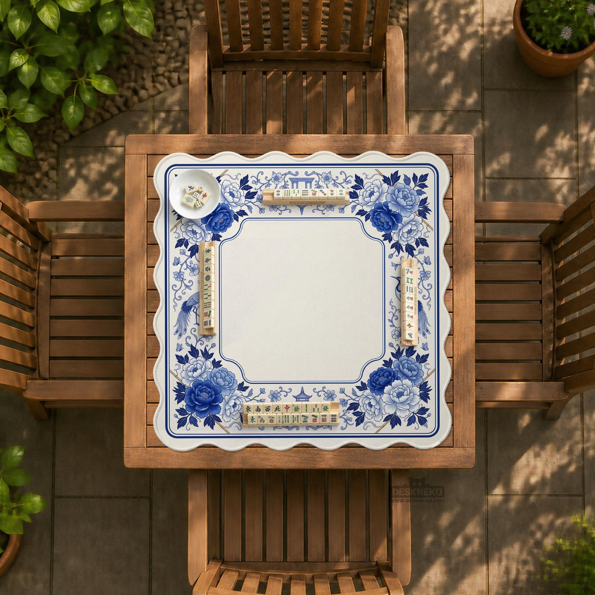 Square blue and white mahjong mat with peonies, cranes, pagoda accents, and chinoiserie linework around a plain center.