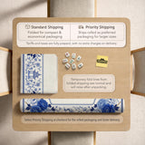 Square blue and white mahjong mat with peonies, cranes, pagoda accents, and chinoiserie linework around a plain center.