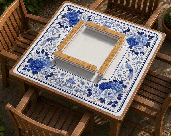 Square blue and white mahjong mat with peonies, cranes, pagoda accents, and chinoiserie linework around a plain center.