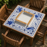 Square blue and white mahjong mat with peonies, cranes, pagoda accents, and chinoiserie linework around a plain center.