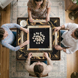 Black mahjong table mat with a gold dragon border, gold geometric corner details, and a clear center play area.