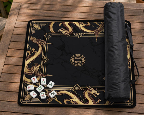 Square black mahjong mat with gold dragon artwork around the border and a light marble texture in the center.