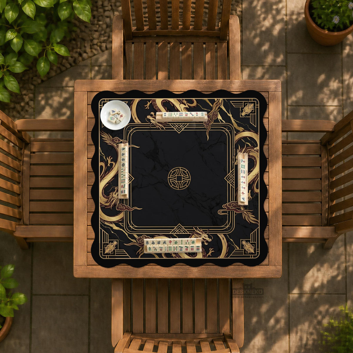 Black mahjong table mat with a gold dragon border, gold geometric corner details, and a clear center play area.