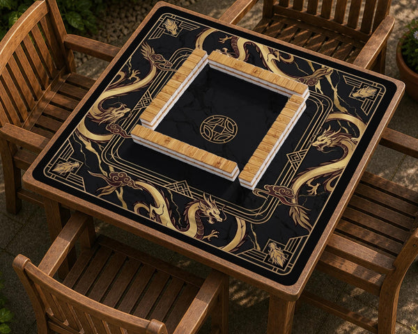 Square black mahjong mat with gold dragon artwork around the border and a light marble texture in the center.