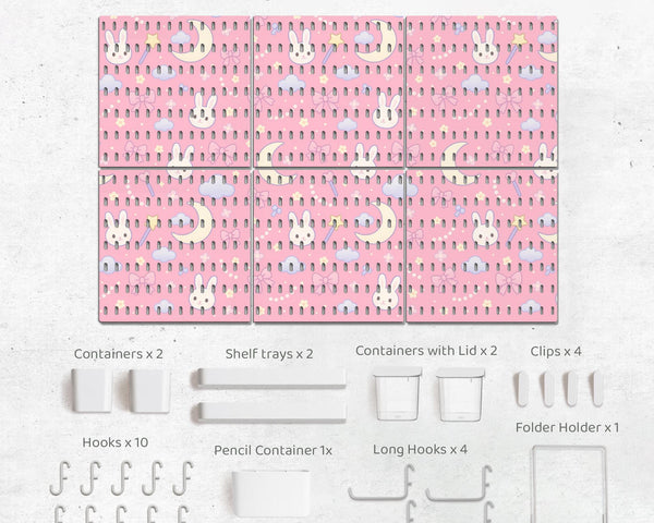 Pink pegboard panels with a kawaii bunny, cloud, moon, bow, and star pattern shown as a wall organizer set.