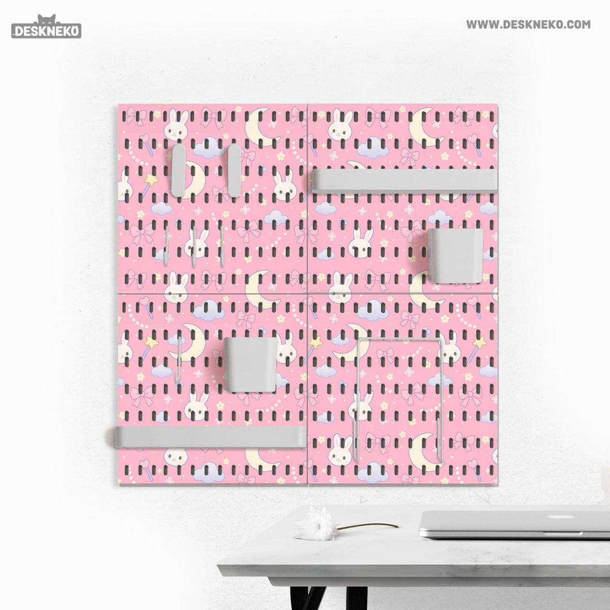 Pink pegboard panels with a kawaii bunny, cloud, moon, bow, and star pattern shown as a wall organizer set.