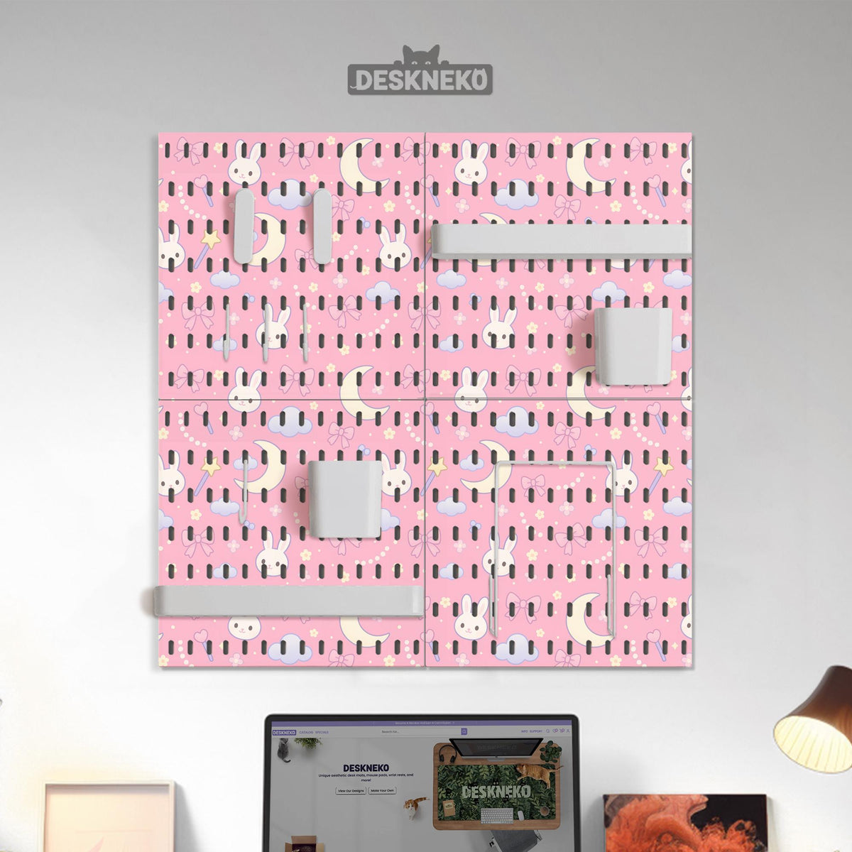 Pink pegboard panels with a kawaii bunny, cloud, moon, bow, and star pattern shown as a wall organizer set.