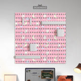 Pink pegboard panels with a kawaii bunny, cloud, moon, bow, and star pattern shown as a wall organizer set.