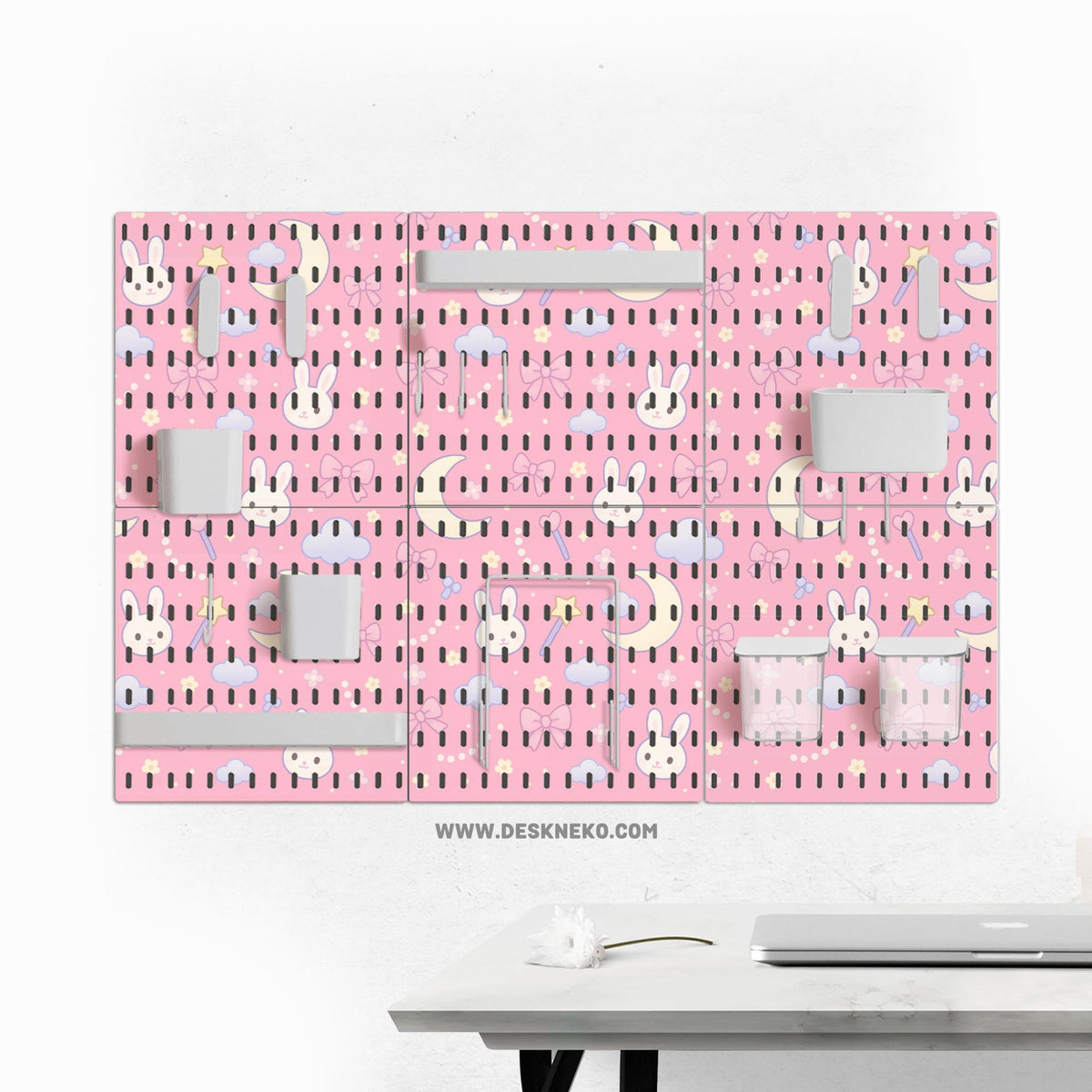 Pink pegboard panels with a kawaii bunny, cloud, moon, bow, and star pattern shown as a wall organizer set.
