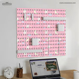 Pink pegboard panels with a kawaii bunny, cloud, moon, bow, and star pattern shown as a wall organizer set.