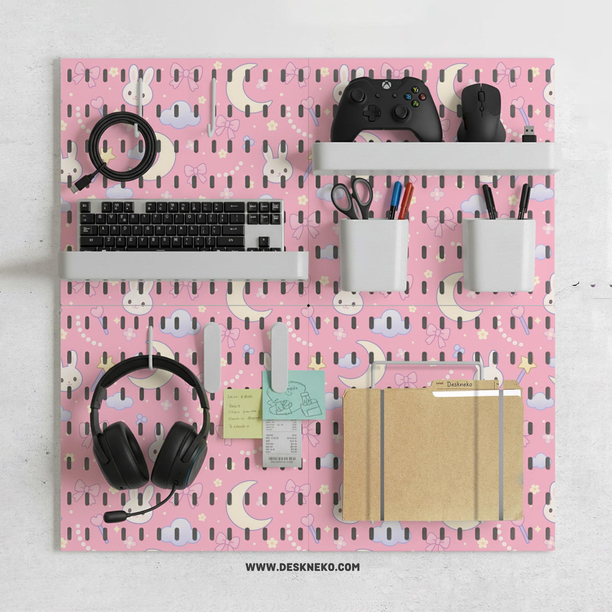 Pink pegboard panels with a kawaii bunny, cloud, moon, bow, and star pattern shown as a wall organizer set.