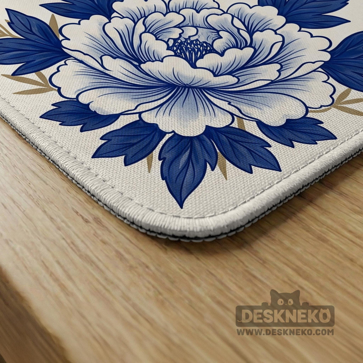 Blue and white mahjong mat with cranes, floral porcelain-style artwork, a cream center area, and a decorative border.