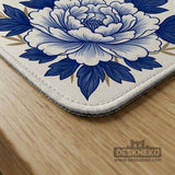 Blue and white mahjong mat with cranes, floral porcelain-style artwork, a cream center area, and a decorative border.
