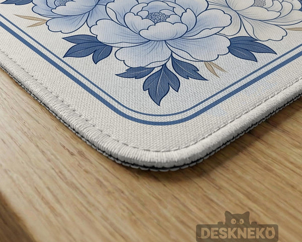 Square mahjong mat with a blue chinoiserie floral pattern on a light background.