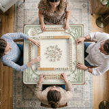 Square light green mahjong mat with bamboo stalks, soft ivory details, botanical shadows, mist lines, and a circular center design.