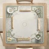 Square light green mahjong mat with bamboo stalks, soft ivory details, botanical shadows, mist lines, and a circular center design.