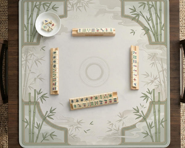Square light green mahjong mat with bamboo stalks, soft ivory details, botanical shadows, mist lines, and a circular center design.