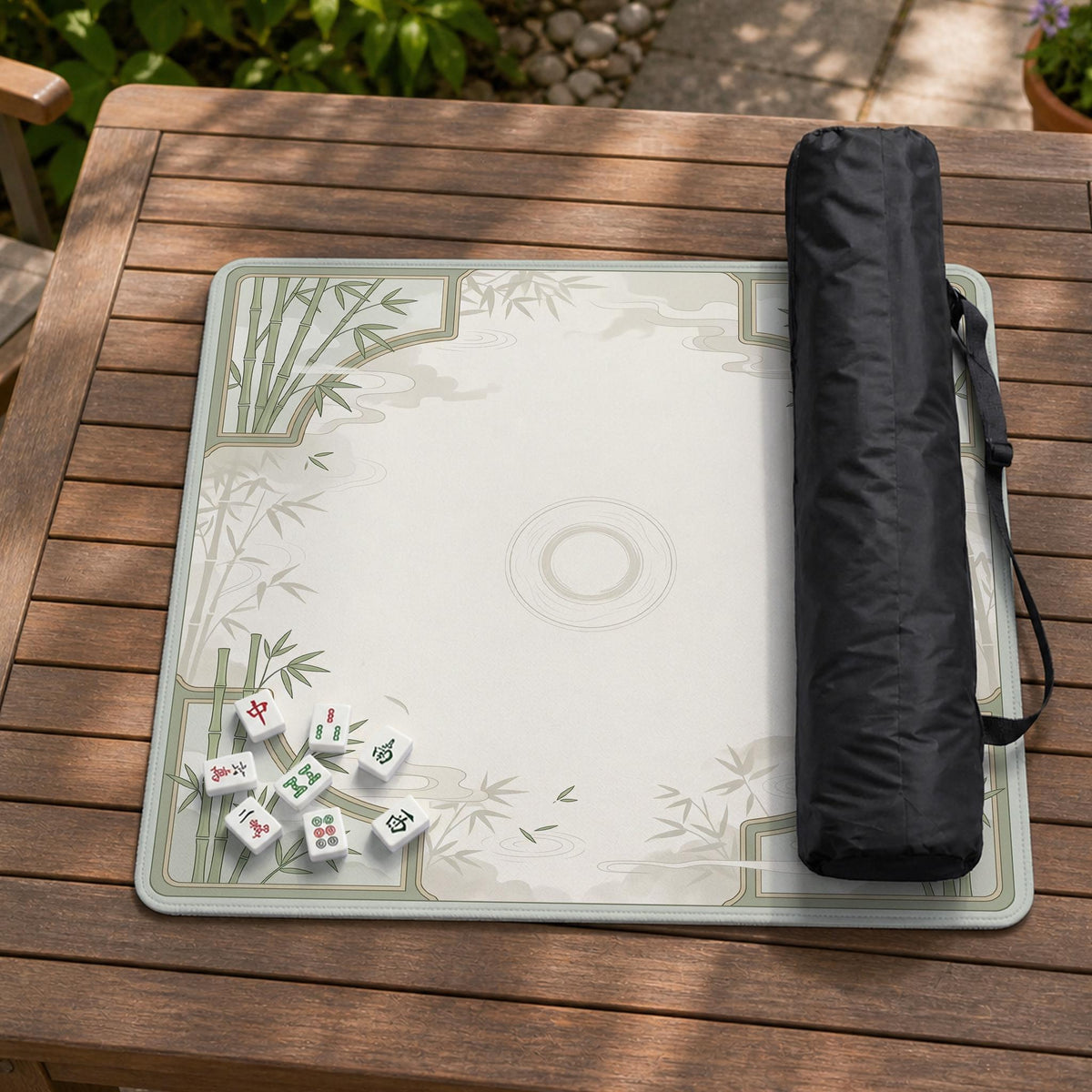 Square mahjong table mat with a pale cream center and green bamboo chinoiserie corners and border.