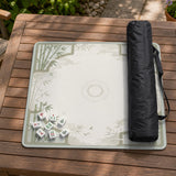 Square mahjong table mat with a pale cream center and green bamboo chinoiserie corners and border.