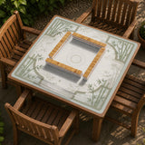 Square mahjong table mat with a pale cream center and green bamboo chinoiserie corners and border.