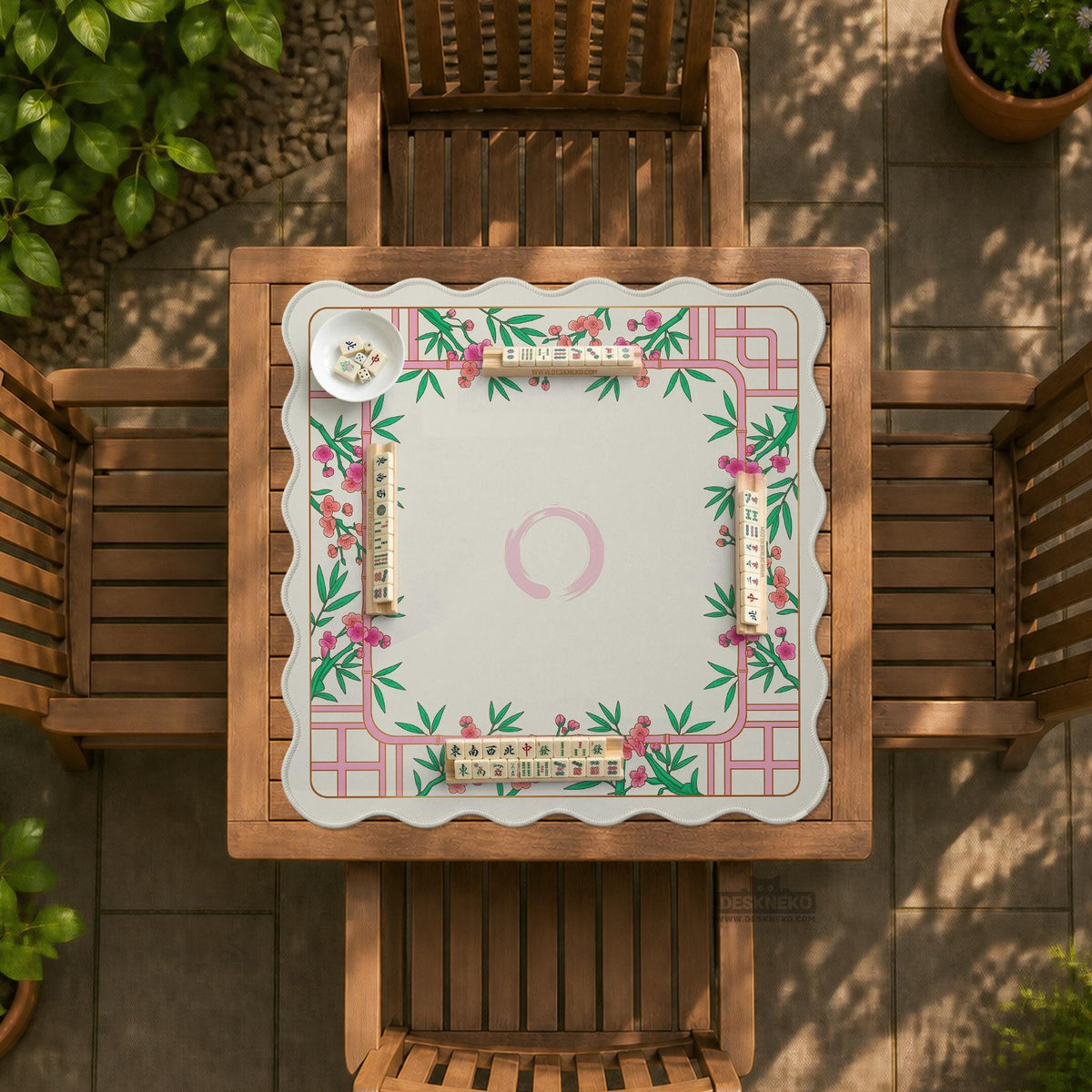 Pink cherry blossom floral mahjong table mat with a cream center and bamboo-style border design.
