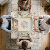 Pink cherry blossom floral mahjong table mat with a cream center and bamboo-style border design.