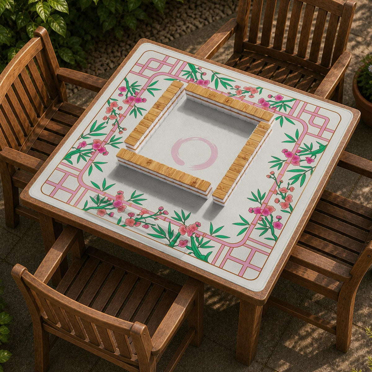 Pink cherry blossom floral mahjong table mat with a cream center and bamboo-style border design.