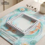 Pastel aqua square mahjong mat with orange koi fish, lotus flowers, lily pads, and flowing water lines.