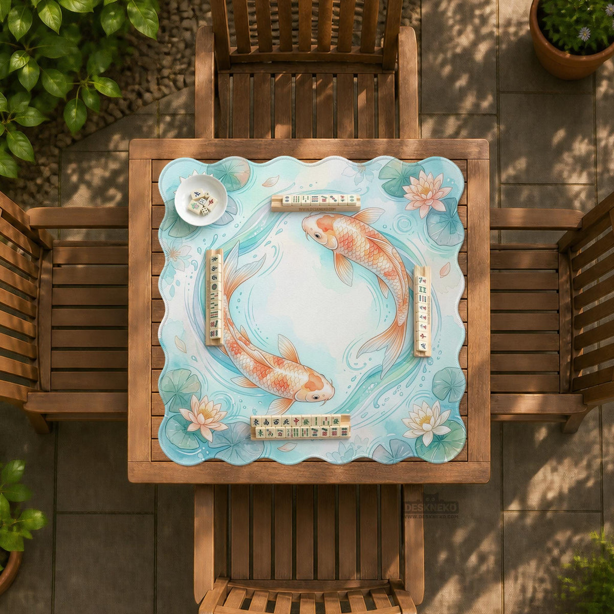 Pastel aqua square mahjong mat with orange koi fish, lotus flowers, lily pads, and flowing water lines.