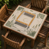 Square mahjong mat with a sage green bamboo and mountain design, cream center, scalloped border details, and gold line accents.